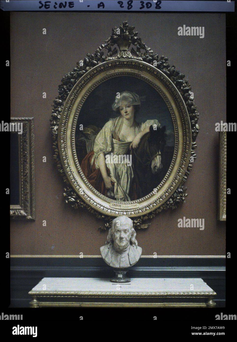 Paris (1. Arr.), Frankreich La Laitière de Greuze und die Büste von Benjamin Franklin by Houdon, Louvre Museum, Stockfoto