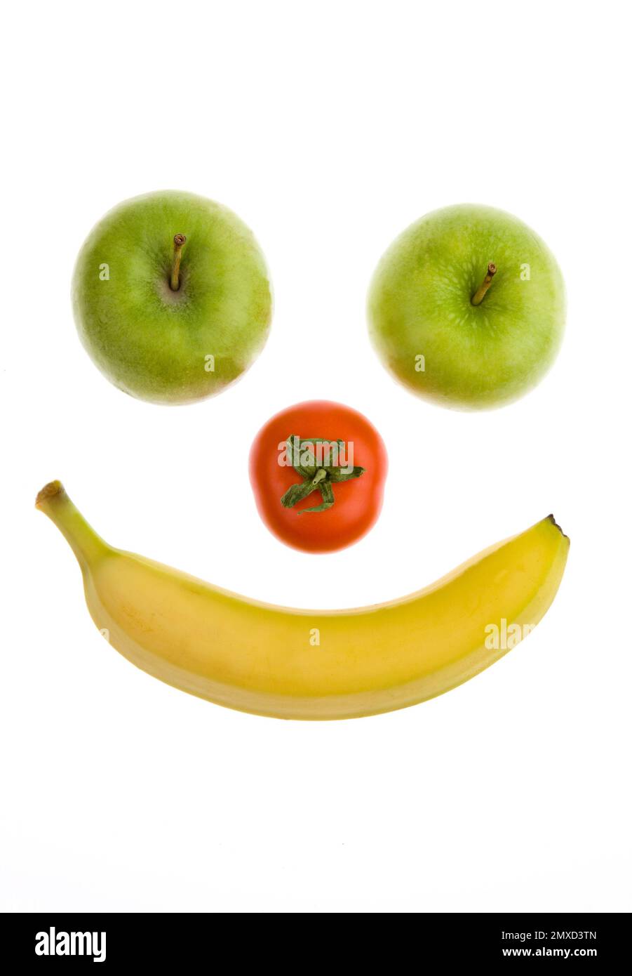Smiley aus Äpfeln, Tomaten und Bananen Stockfoto
