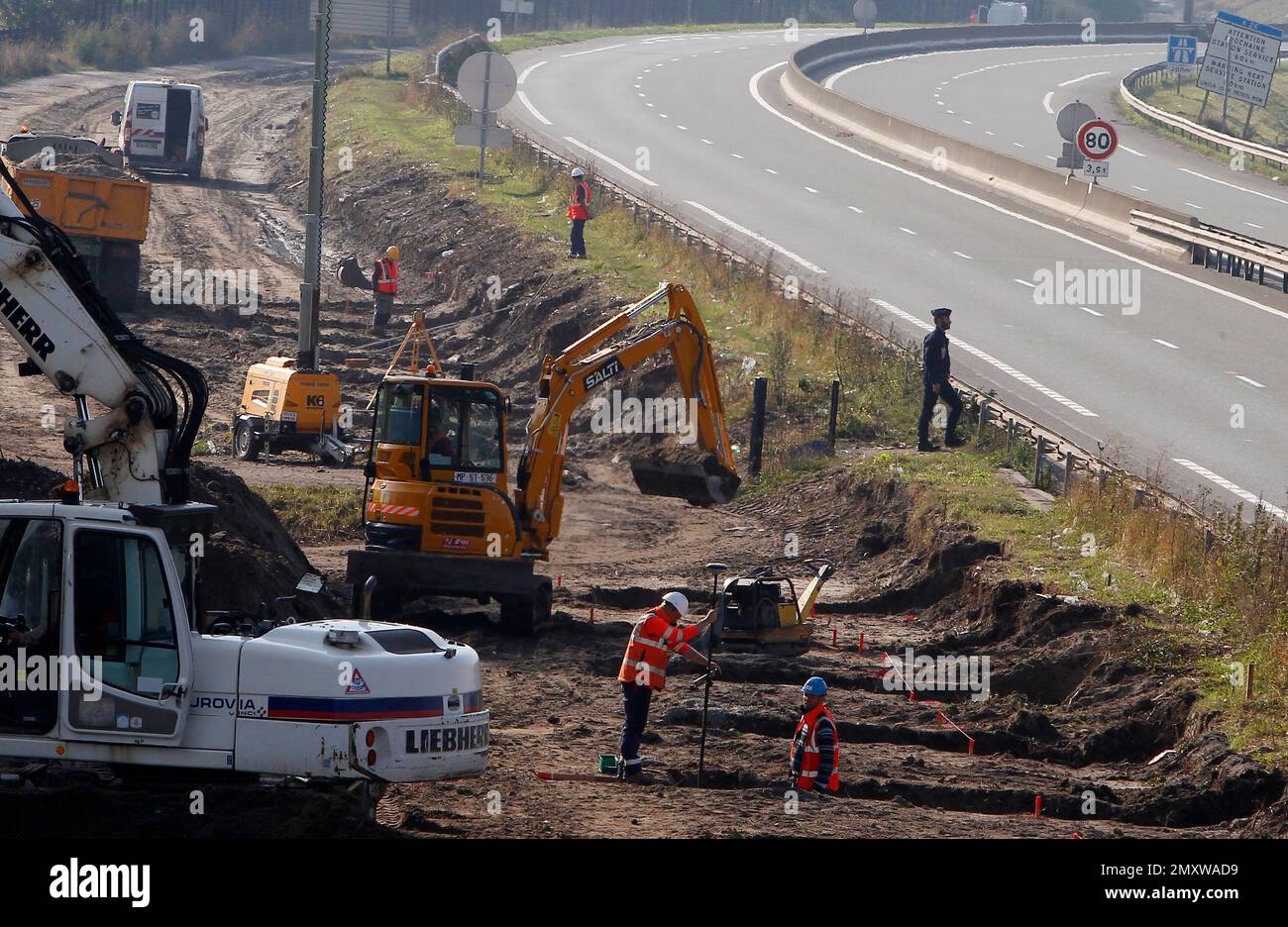 Workers begin construction of a 4meter (13foot) high wall along the