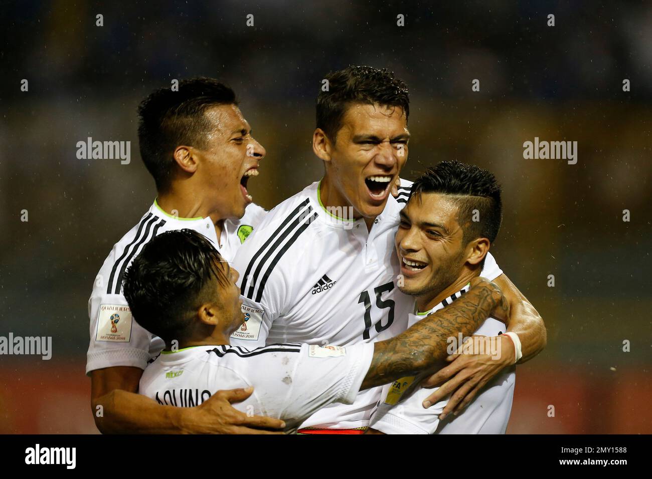 Mexico's Hector Moreno, center, celebrates with teammates after scoring against El Salvador during a 2018 World Cup qualifier soccer match in San Salvador, El Salvador, Friday, Sept. 2, 2016.(AP Photo/Moises Castillo) Stockfoto