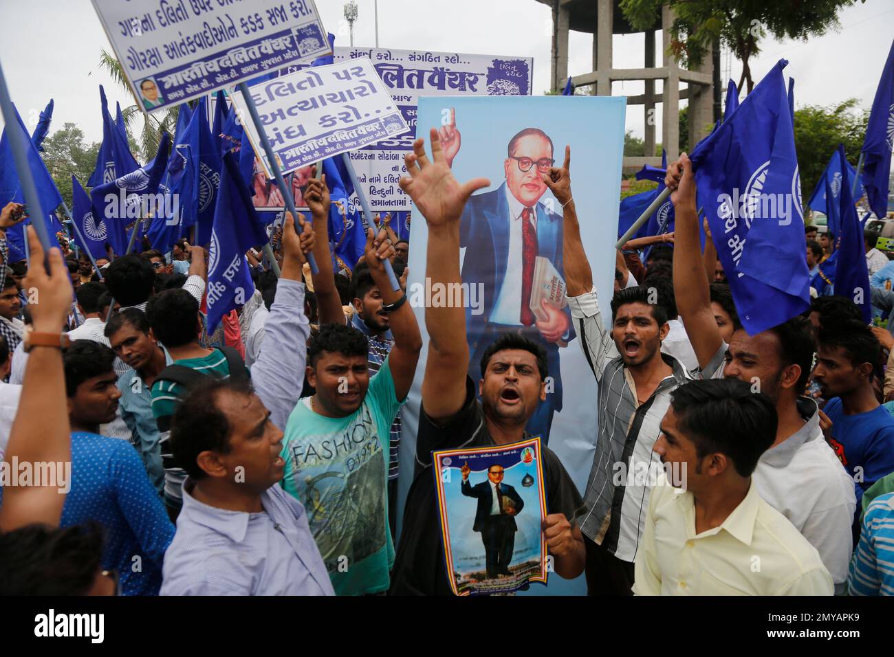 Dalits, a group once known as untouchables in India, hold portraits of ...