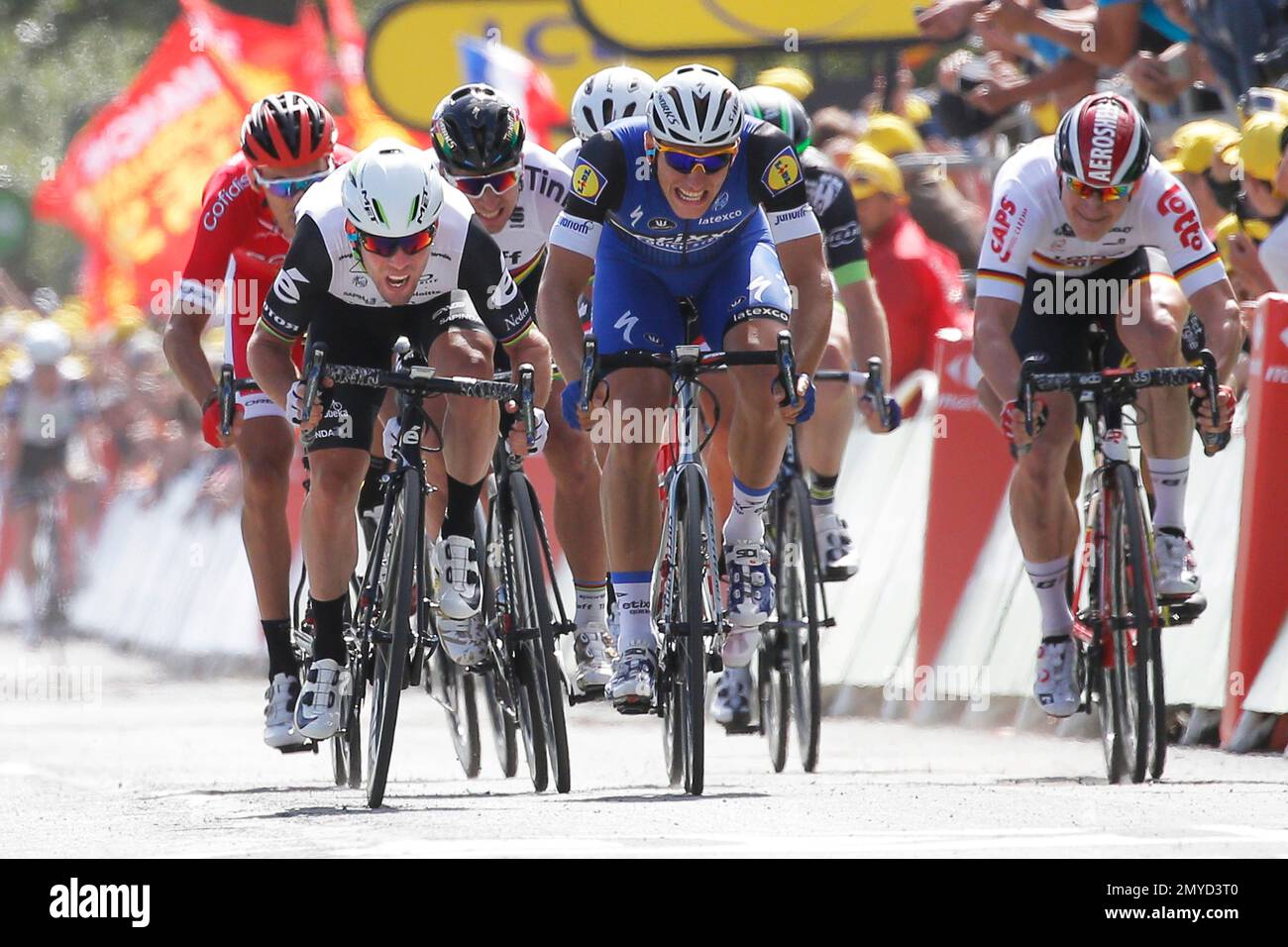 Britain's sprinter Mark Cavendish, front left, crosses the finish line