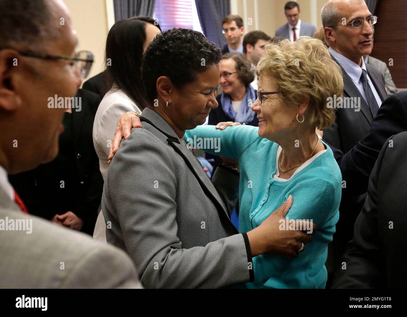 Massachusetts superior court judge kimberly budd center left embraces