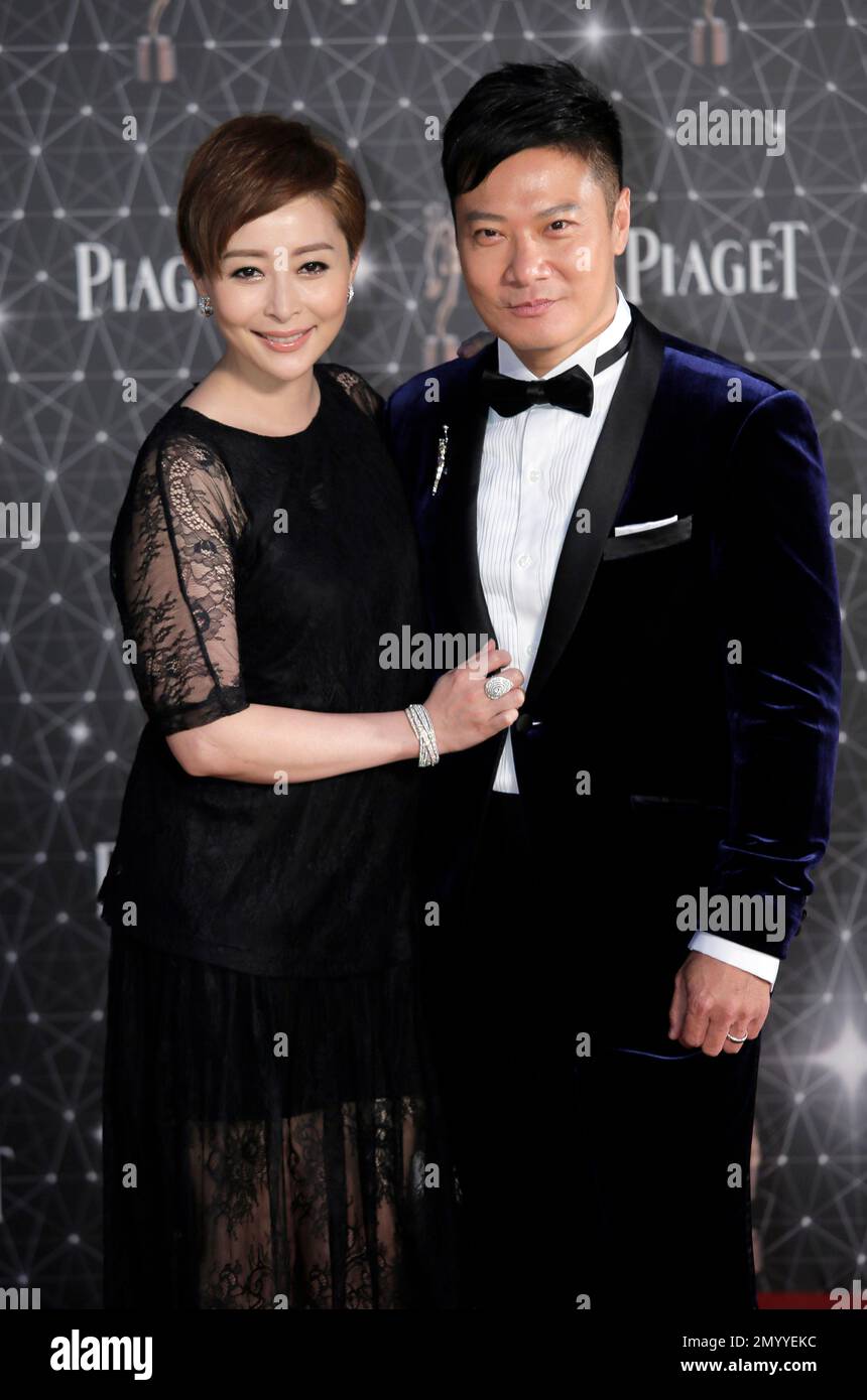 Hong Kong martial arts director Chin Ka Lok and his wife Angela Tong pose on the red carpet of the Hong Kong Film Awards in Hong Kong, Sunday, April 3, 2016. (AP Photo/Vincent Yu) Stockfoto
