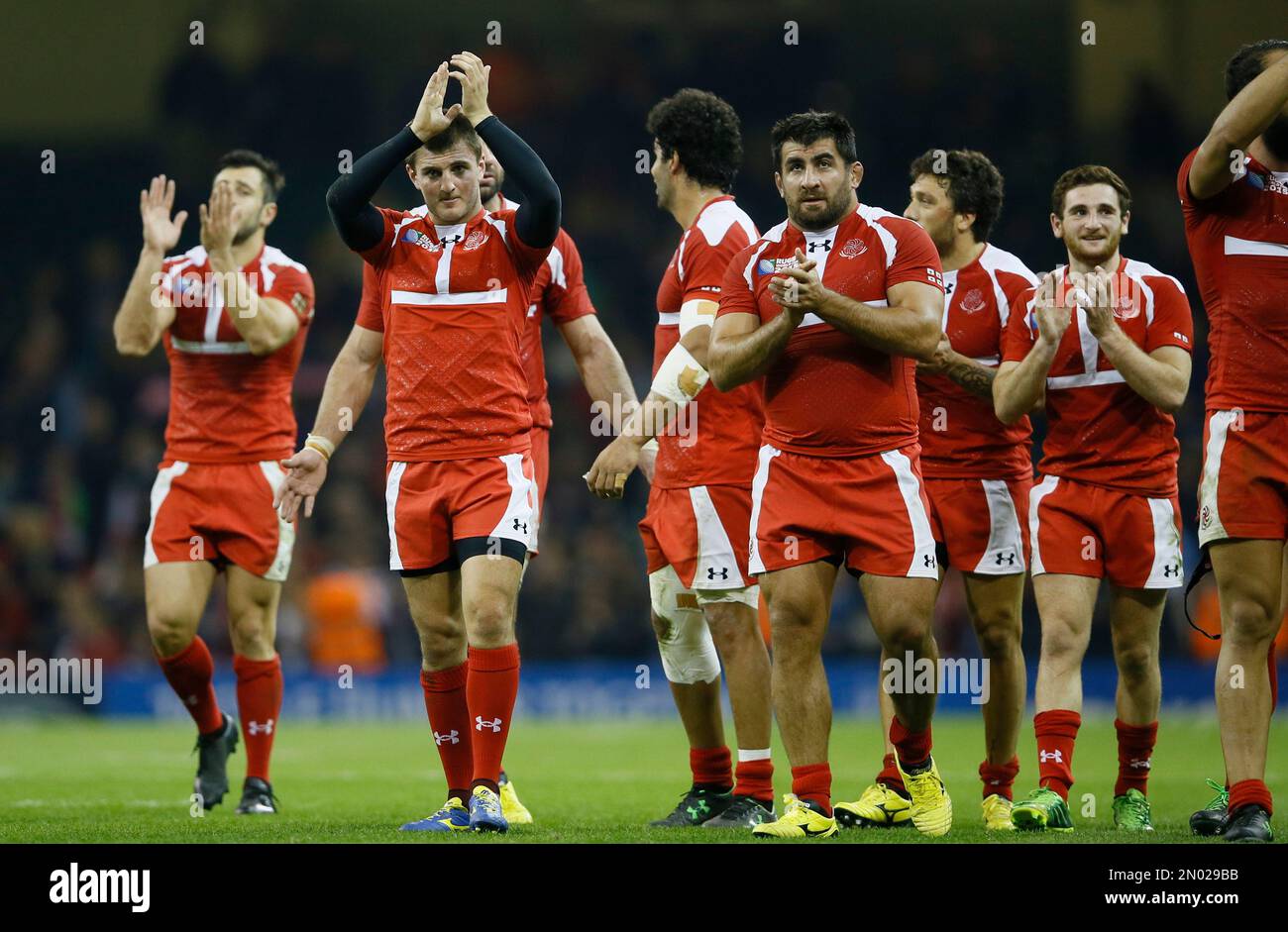 FILE- In this Oct. 2, 2015 file photo, Georgia players acknowledge the crowd after the Rugby World Cup Pool C match between New Zealand and Georgia at the Millennium Stadium, Cardiff. Georgia and Romania continue to dominate in the European Nations Cup containing Europe’s second-tier countries, and will meet for their latest tournament decider, in front of an expected 50,000 fans in Tbilisi on Saturday, March 19, 2016. (AP Photo/Kirsty Wigglesworth, File) Stockfoto