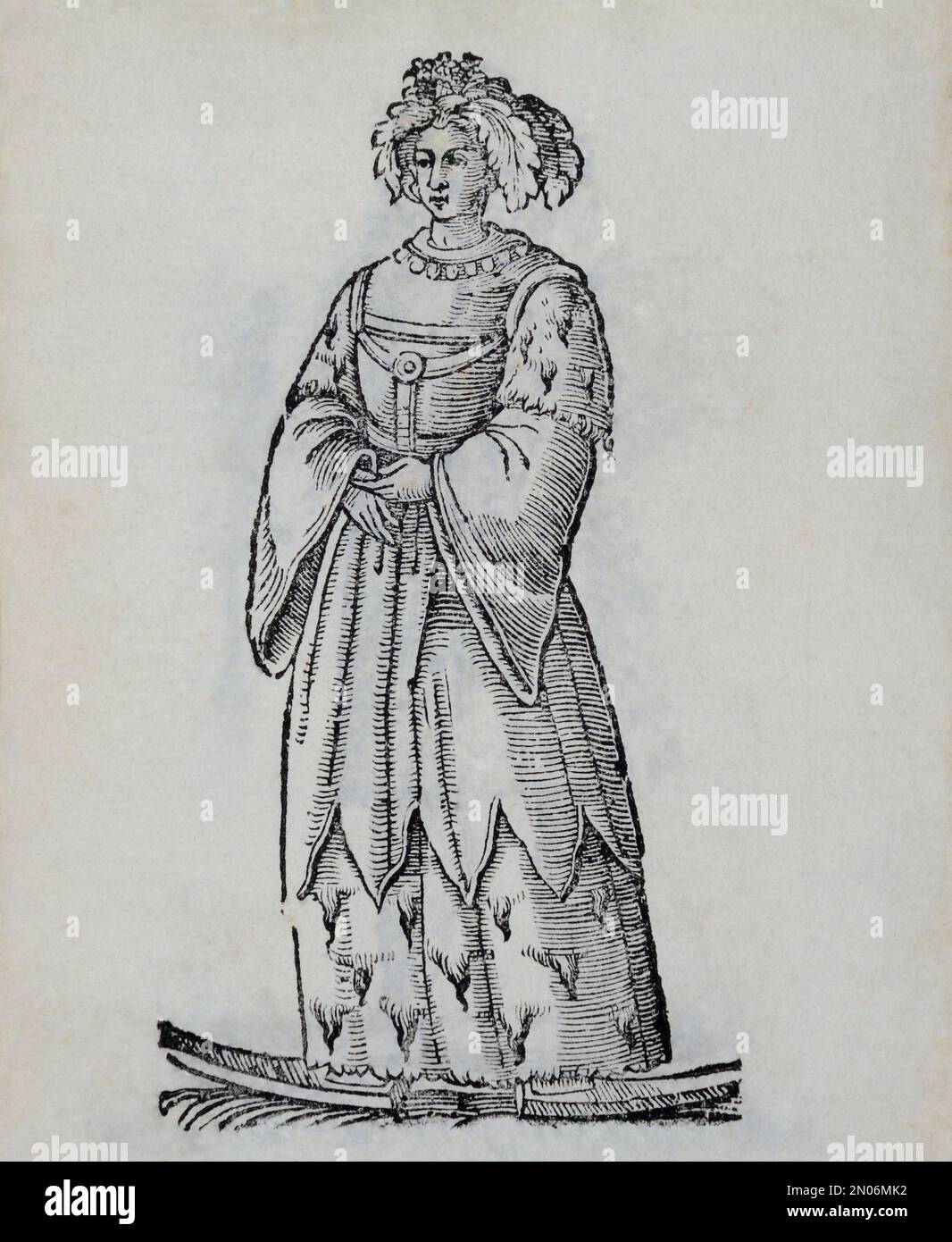 Ein sehr frühes Bild einer weiblichen Laplanerin, Sami, mit Kopfbedeckung, Pelzrock, Himmel in ihren Füßen. Dieser schmückende Holzschnitt aus dem Stockfoto
