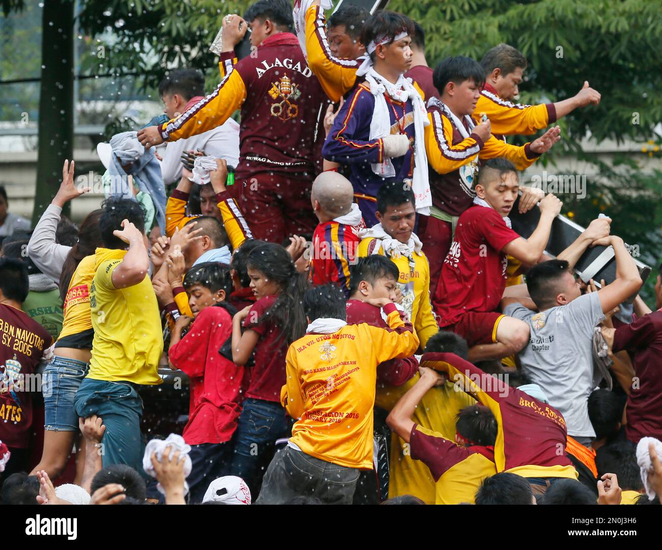 Roman Catholic devotees are occasionally showered with water as they ...