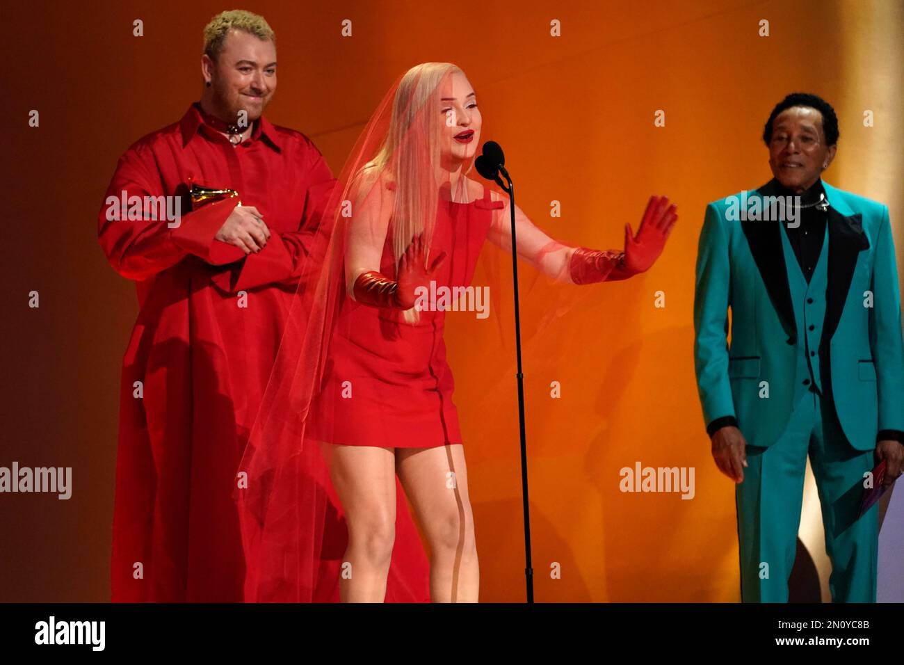 Kim Petras, center, and Sam Smith accept the award for best pop duo