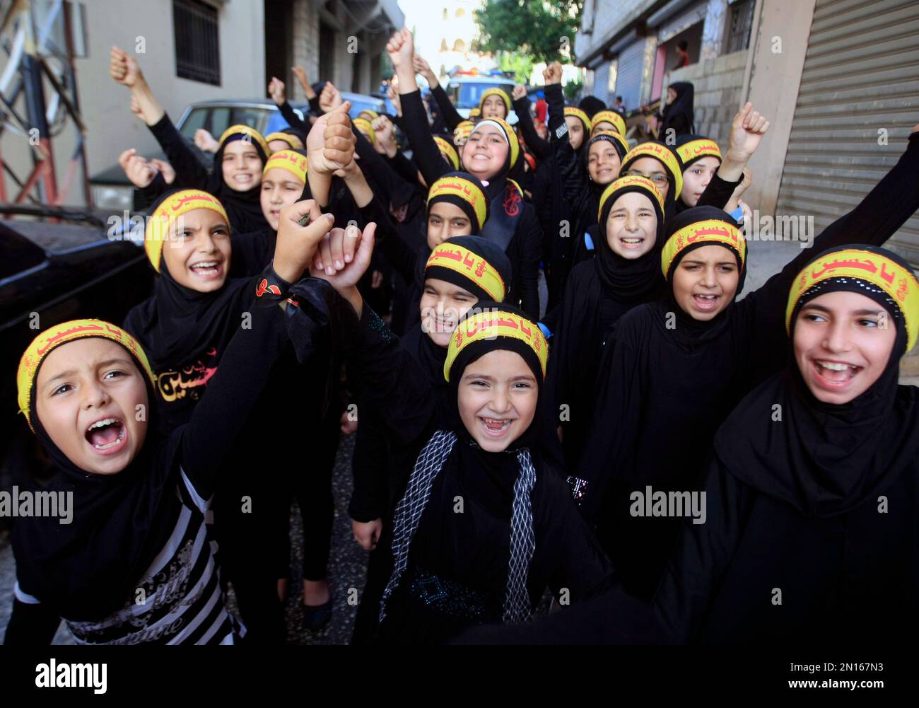 Girls chant slogans during a rally to mark the fifth day of Ashoura in ...