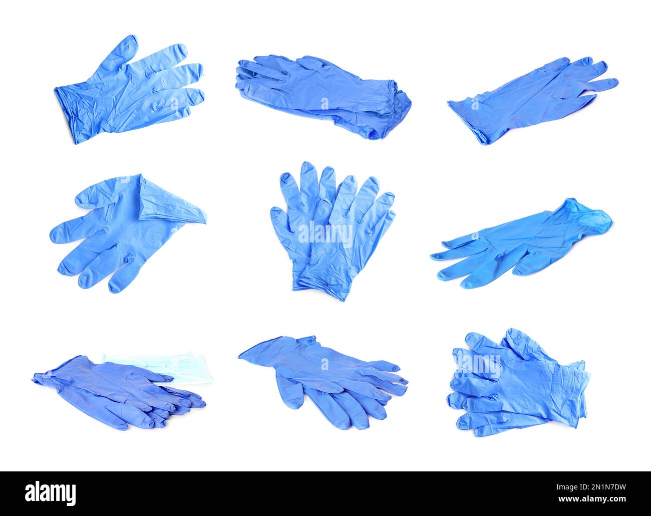 Satz medizinischer Handschuhe auf weißem Hintergrund Stockfoto