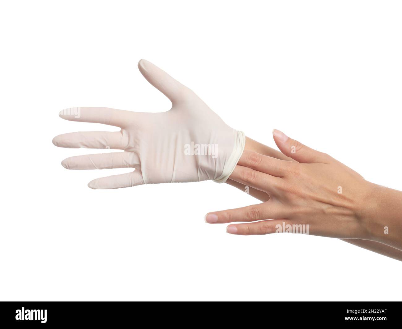 Arzt zieht medizinische Handschuhe auf weißem Hintergrund aus, Nahaufnahme Stockfoto