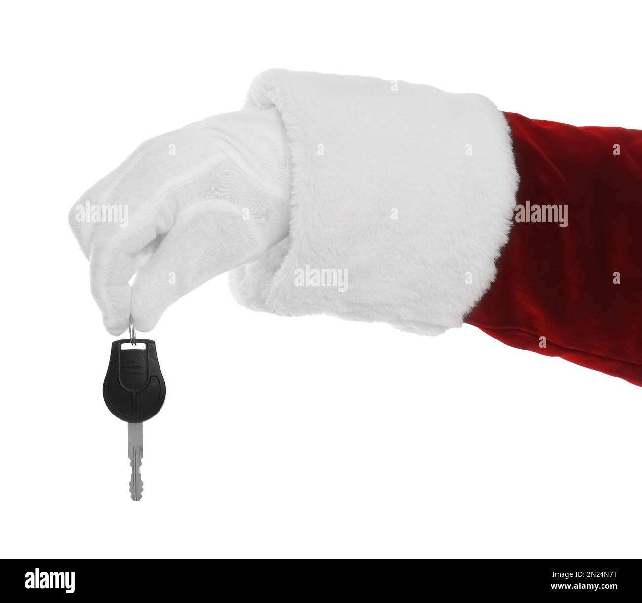 Der Weihnachtsmann hält den Autoschlüssel auf weißem Hintergrund, Nahaufnahme der Hand Stockfoto