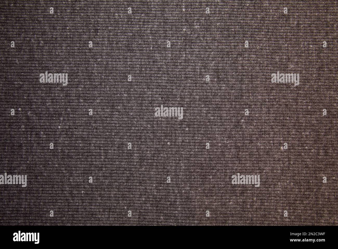 Schwarzer Stoffhintergrund. Schwarzes Stoffgewebe Textilmaterial. Stockfoto