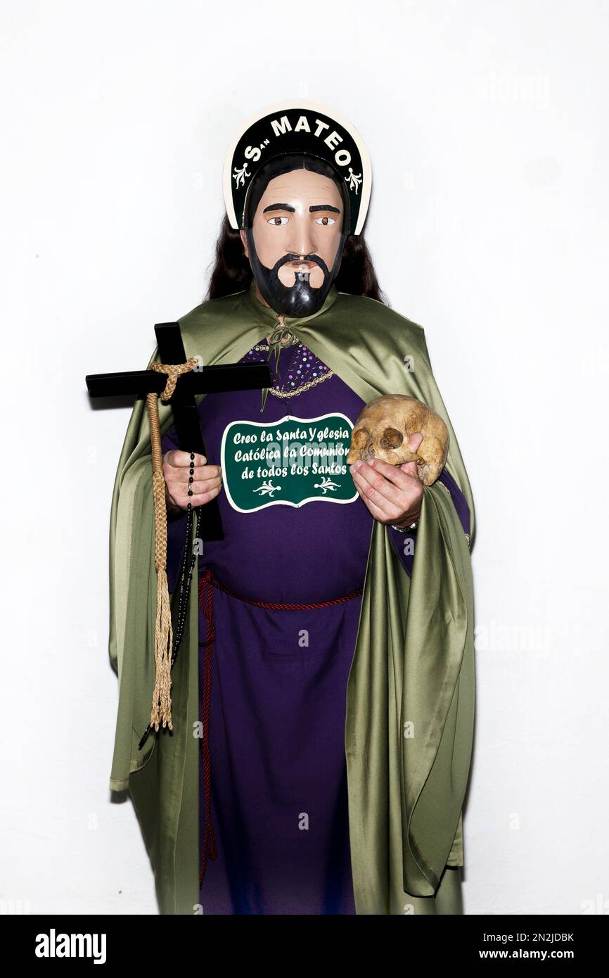 A penitent poses for a picture dressed with typical Apostle dress ...