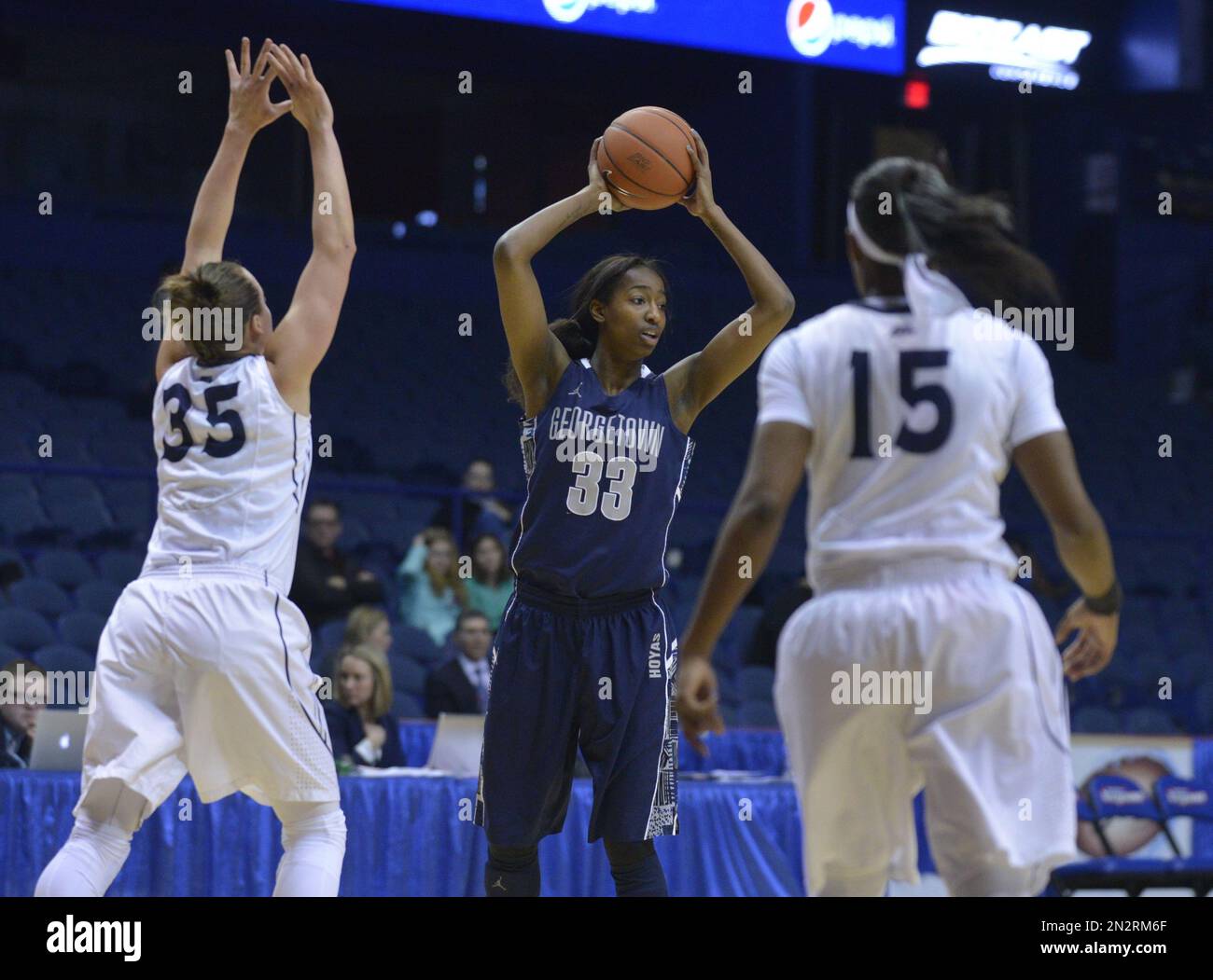 forward Brittany Horne (33) passes against Xavier guard
