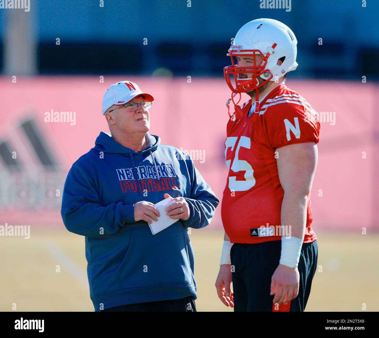 Nebraska offensive line coach Mike Cavanaugh talks to offensive lineman