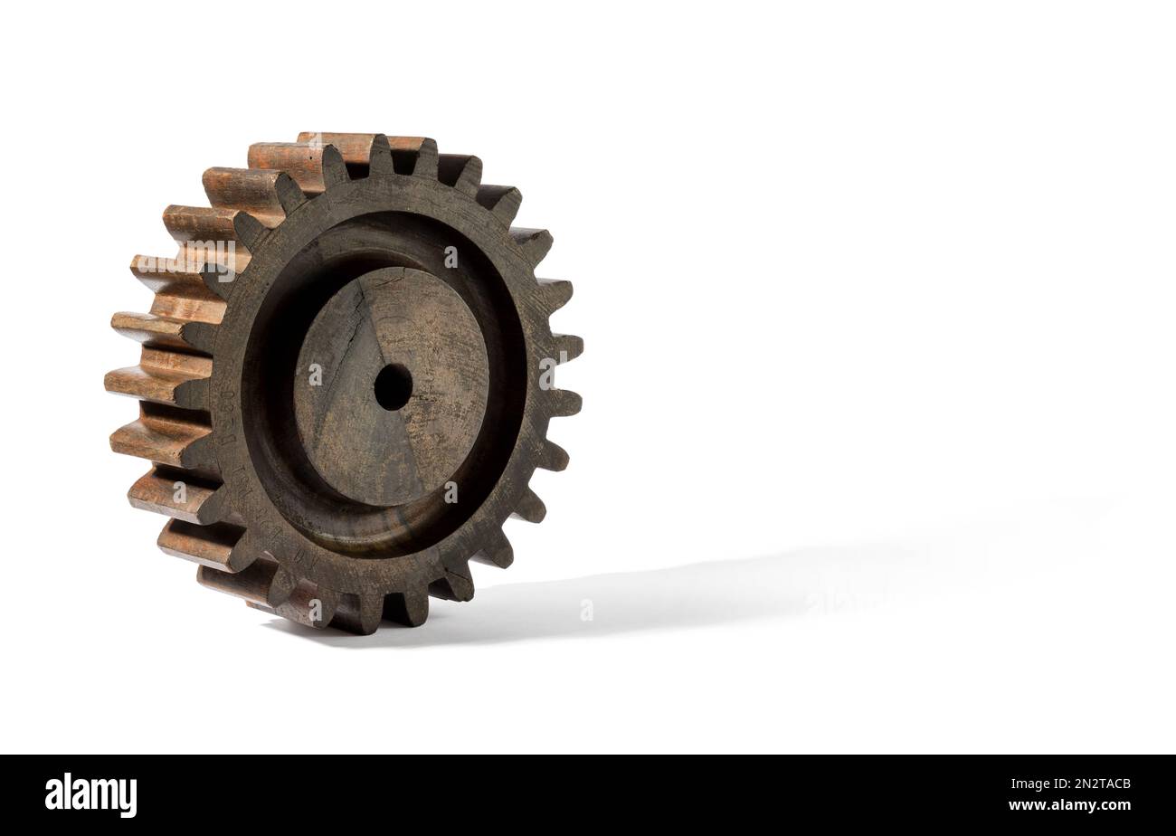 Braunes Vintage-Getriebe aus altem Mechanismus aus Holz, das vor dem Hintergrund rollt Stockfoto