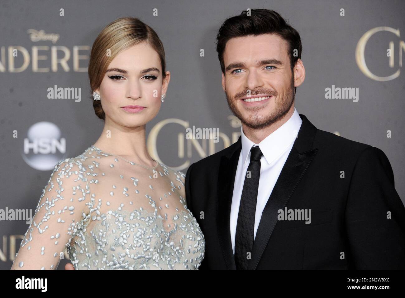 Lily James, left, and Richard Madden arrive at the World Premiere Of "Cinderella" on Sunday, March 1, 2015, in Los Angeles. (Photo by Richard Shotwell/Invision/AP) Stockfoto
