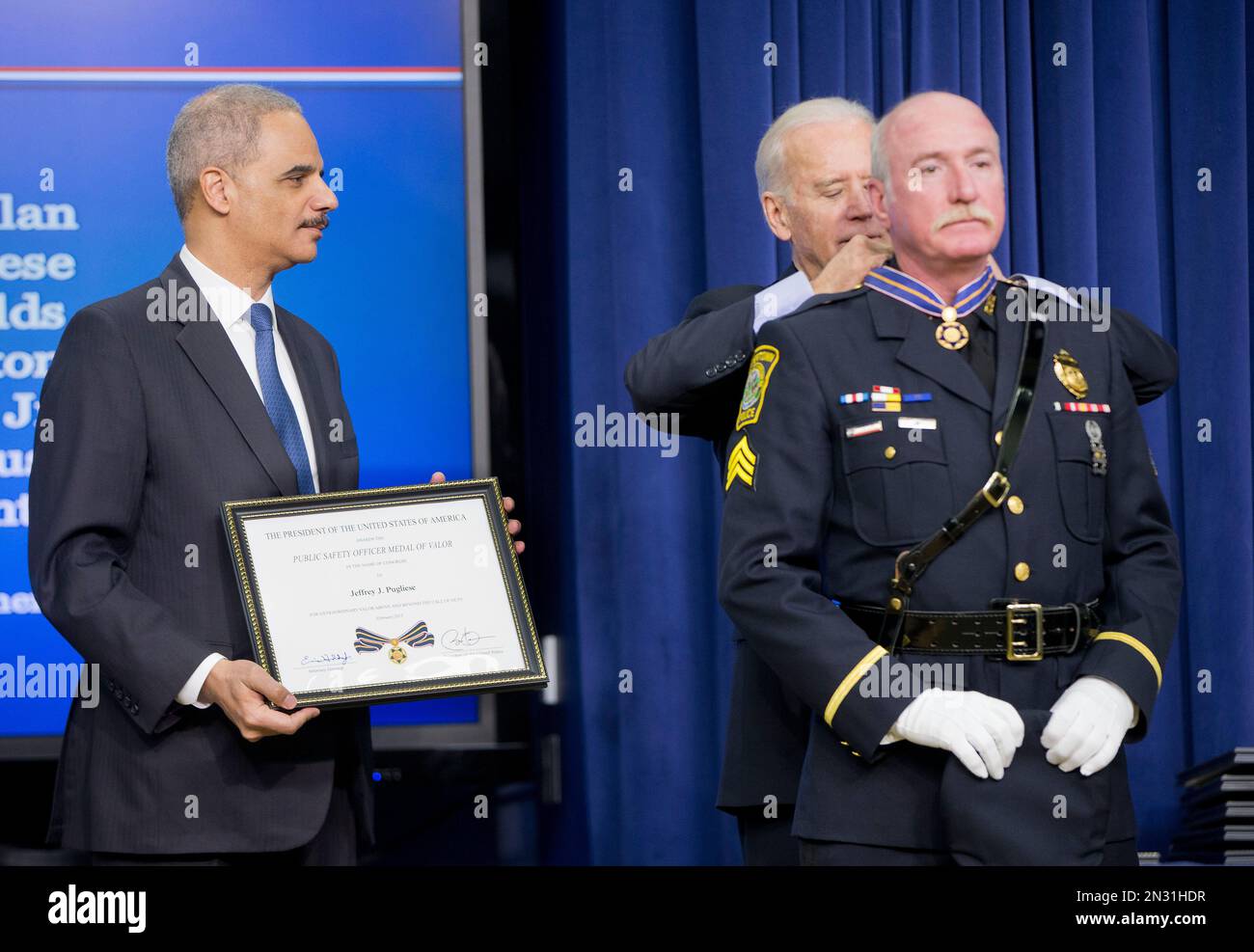Attorney General Eric Holder and Vice President Joe Biden award the