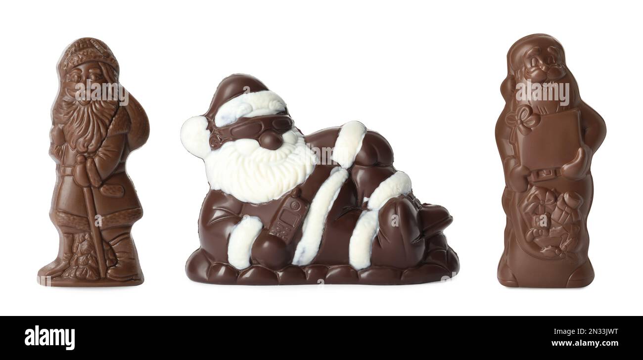 Set mit Weihnachtsmann-Figuren aus Schokolade auf weißem Hintergrund, Bannerdesign Stockfoto