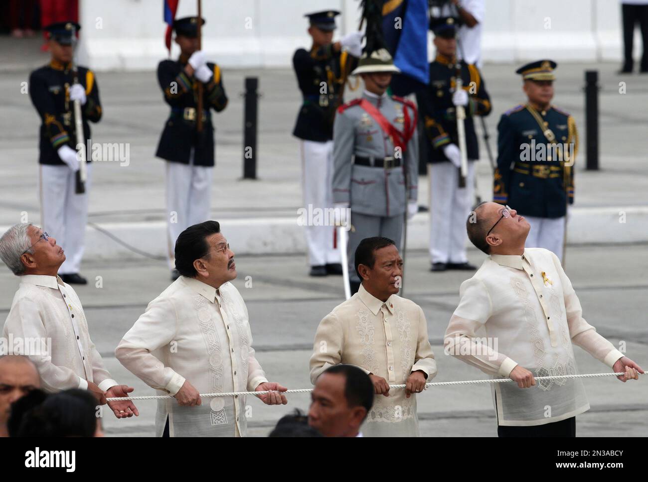 Philippine President Benigno Aquino III, Right, Looks Up As He Leads ...