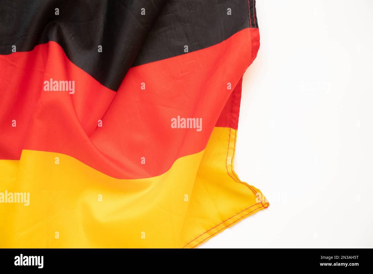 Deutscher Flaggenstoff als Hintergrund, Flagge Deutschlands Stockfoto