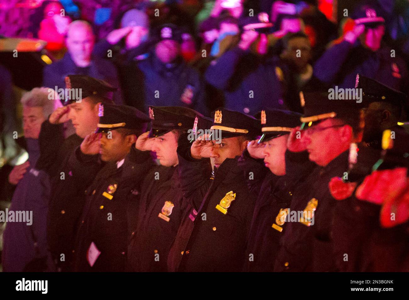 ADDS BOTH OFFICERS KILLED Mourners stand at attention as the bodies