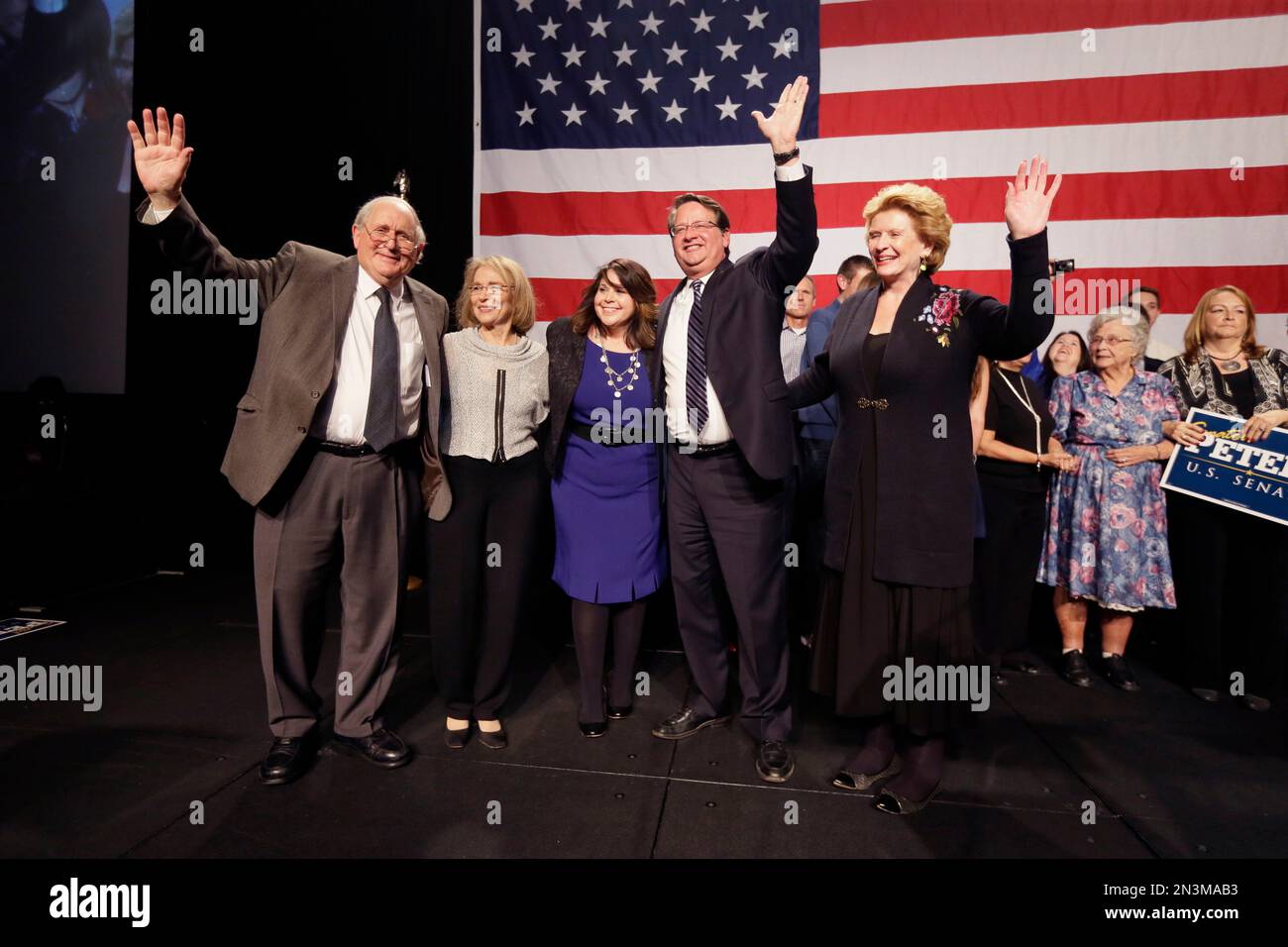 Michigan Senate-elect Gary Peters stands with his wife Colleen, center