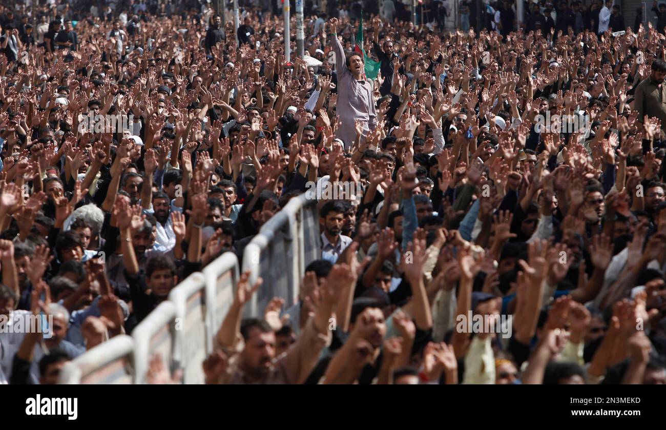 Pakistani Shiite Muslims shout slogans during the holy day of Ashoura ...