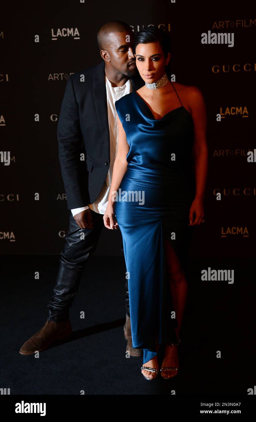 Kanye West, left, and Kim Kardashian arrive at the LACMA Art + Film Gala at LACMA on Saturday, Nov. 1, 2014, in Los Angeles. (Photo by Jordan Strauss/Invision/AP) Stockfoto