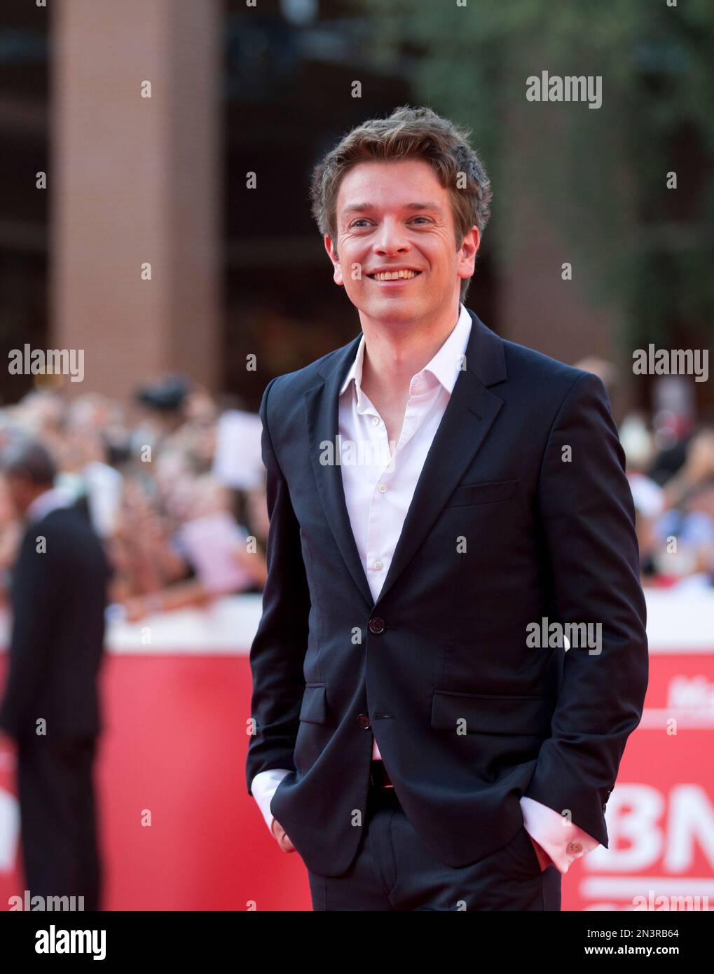 Director Christian Ditter poses for photographers as he arrives on the red carpet for the screening of the movie "Love, Rosie" at the Rome International Film Festival in Rome, Sunday, Oct. 19, 2014. (AP Photo/Alessandra Tarantino) Stockfoto