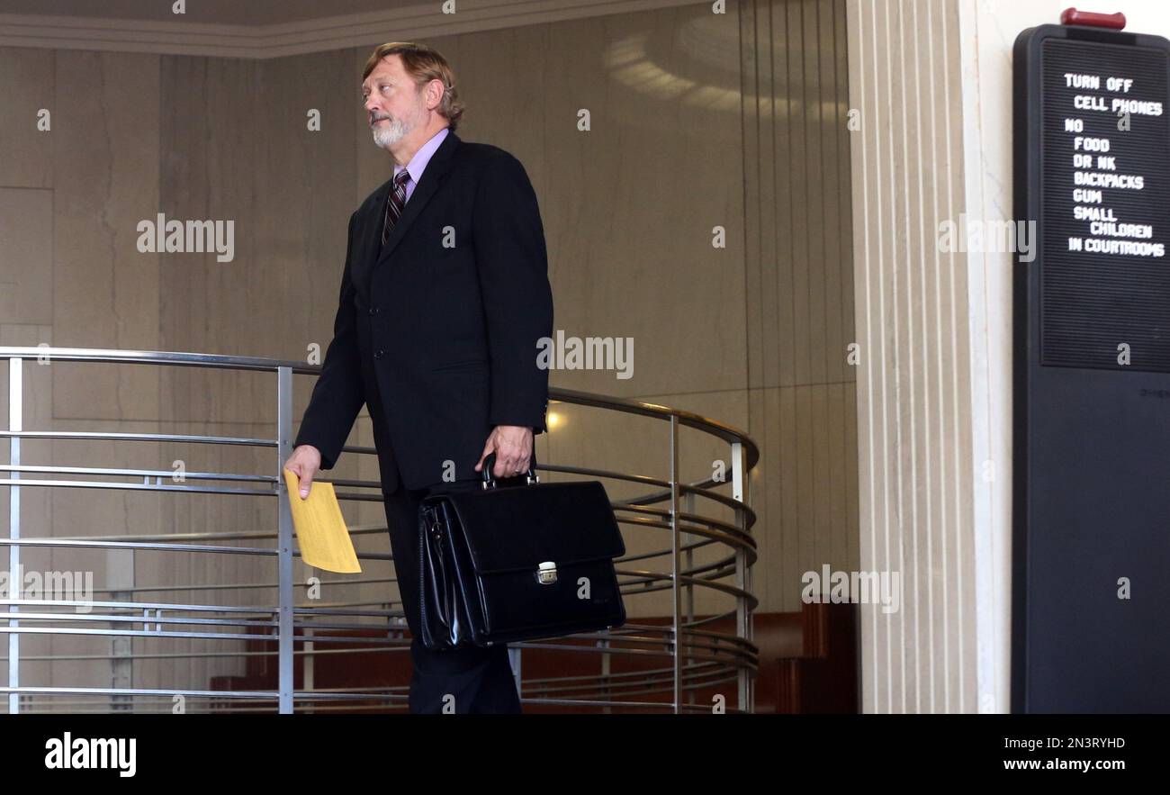 Defense attorney Terry Watkins leaves the courtroom at the Rice County Courthouse Wednesday, Oct