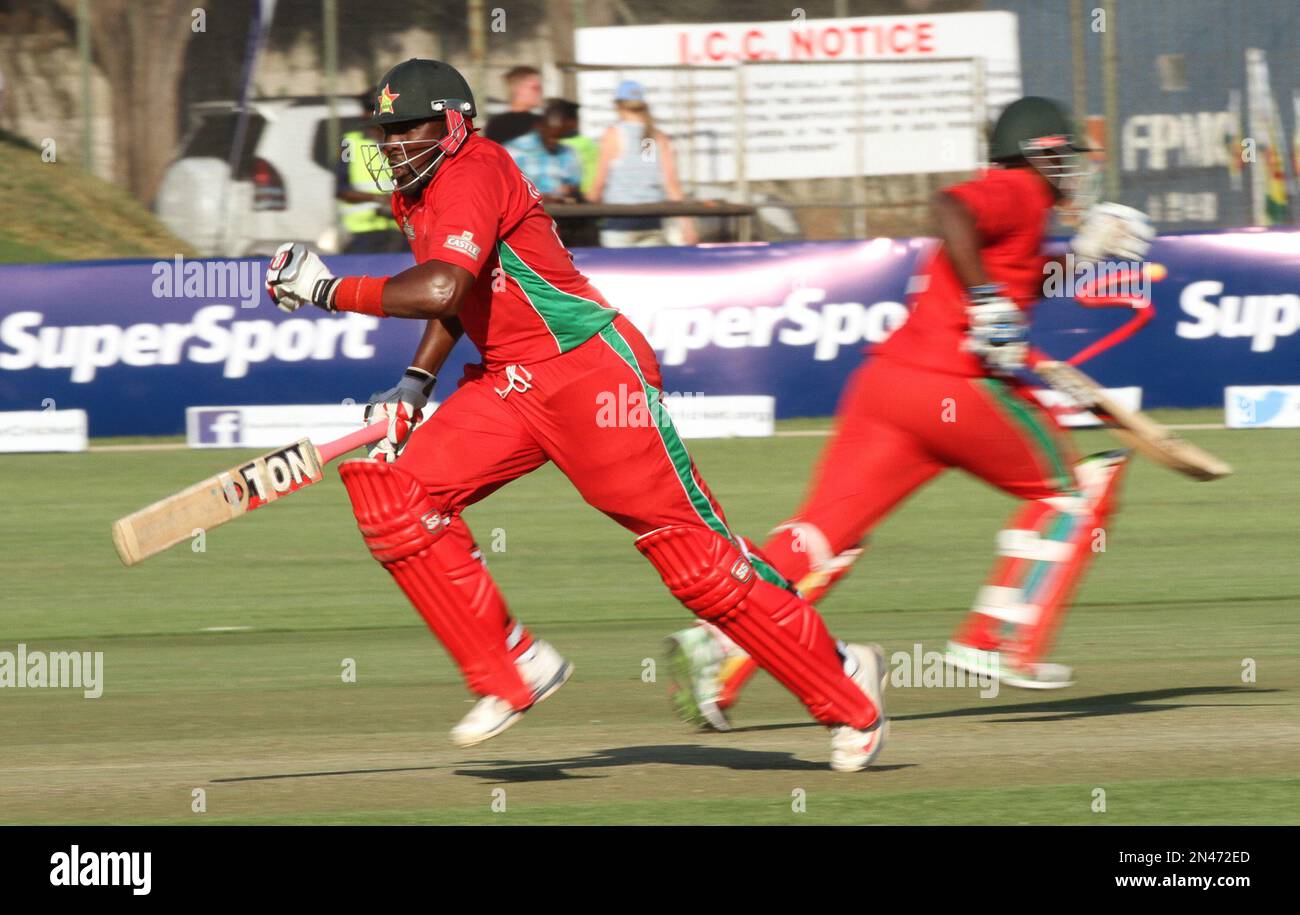 Zimbabwean batsman Hamilton Masakadza, left, makes a run on the first