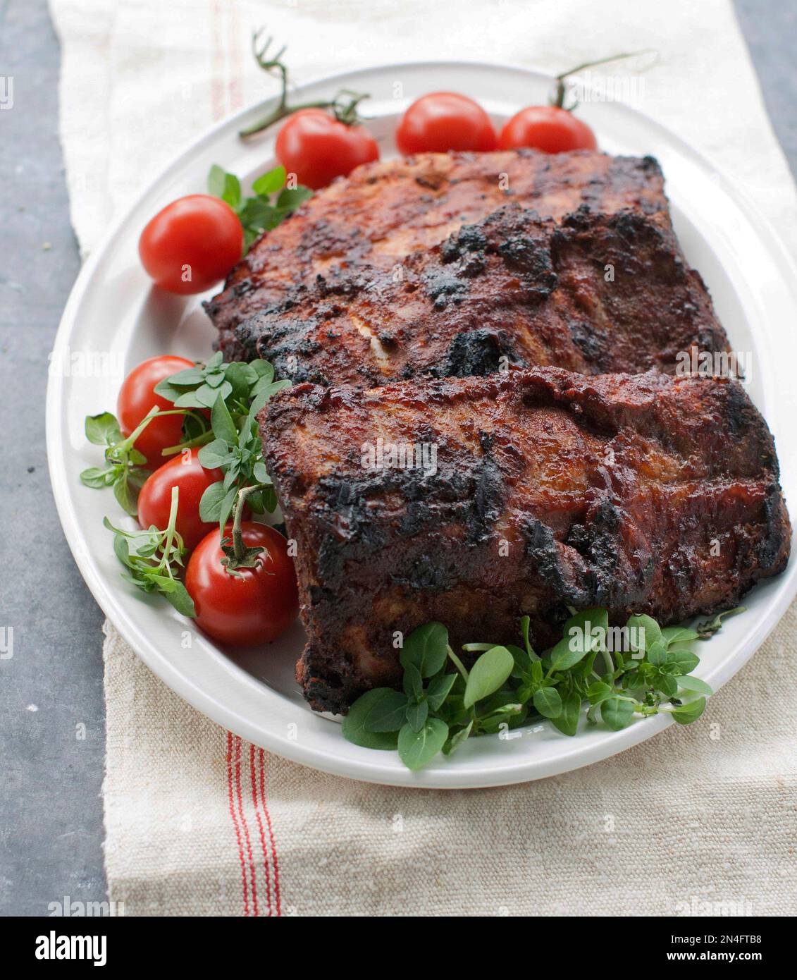 This May 5, 2014 photo shows Memphisstyle baby back ribs in Concord, N