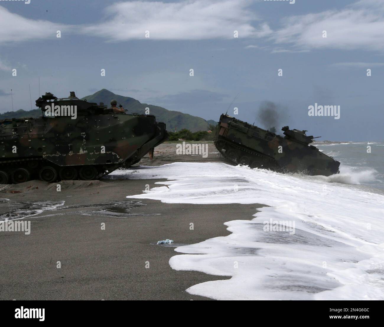 U.S. Navy AAVs (Amphibious Assault Vehicle) maneuver in the water ...