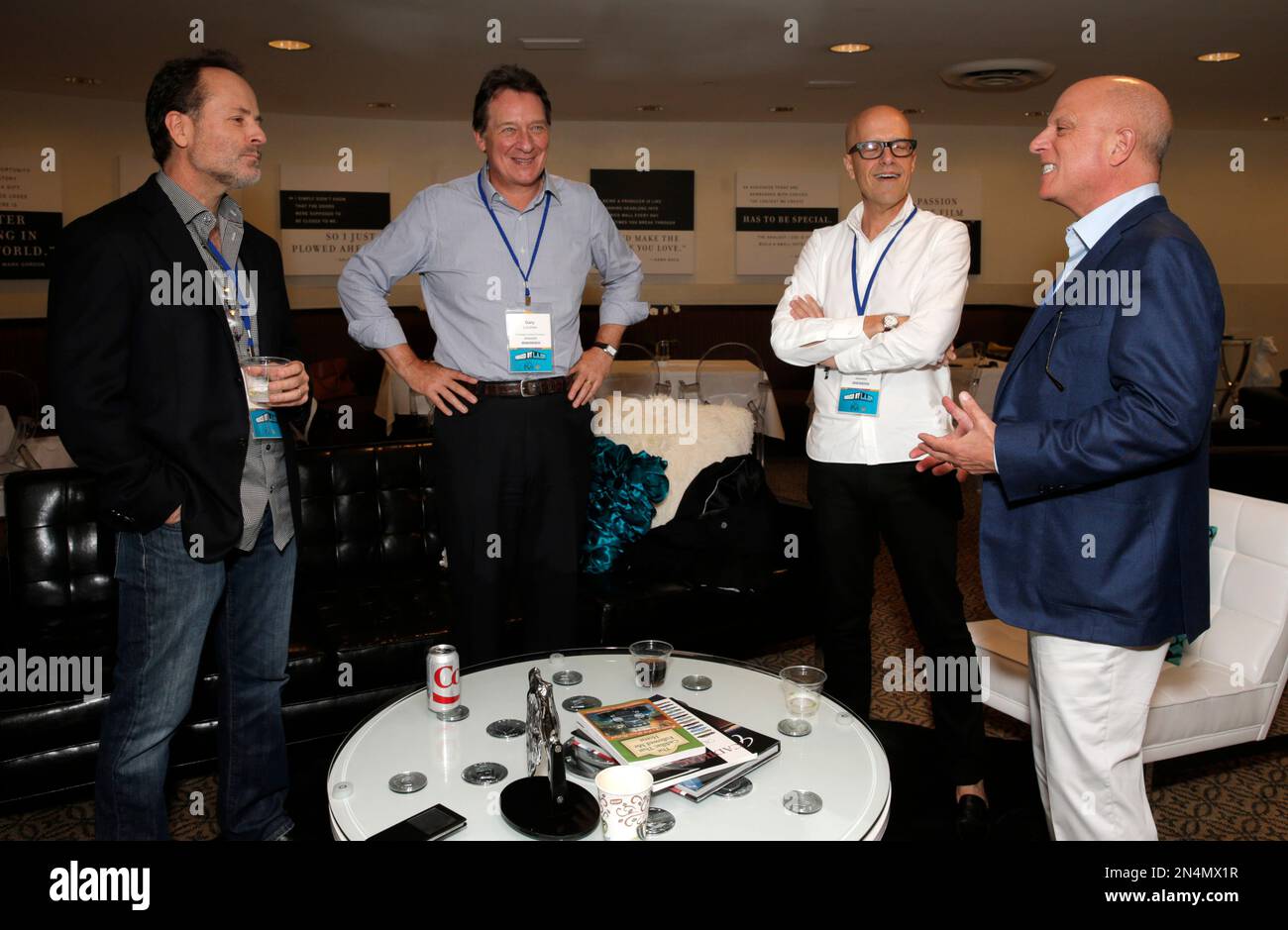 From left, John Landgraf, Gary Lucchesi, Donald De Line, and Chris Albrecht are seen at the 2014 Produced By Conference - Day 1 at Warner Bros. Studios on Saturday, June 7, 2014, in Burbank, Calif. (Photo by Todd Williamson/Invision for Producers Guild of America/AP Images) Stockfoto
