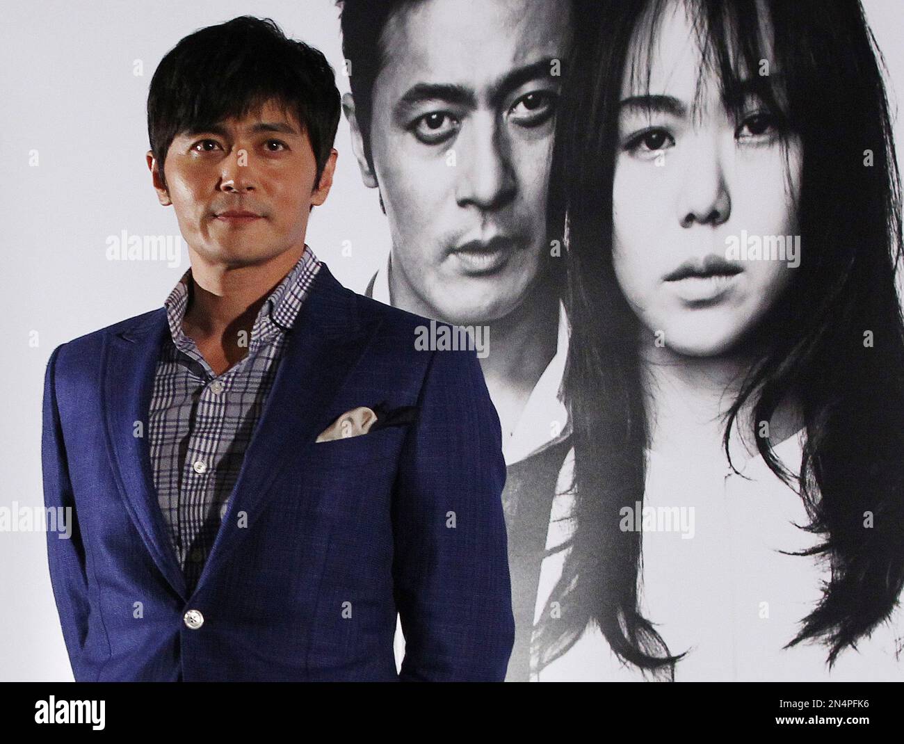 South Korean actor Jang Dong-gun poses during a press conference to promote his latest movie "No Tears for the Dead" in Seoul, South Korea, Friday, May 30, 2014. (AP Photo/Ahn Young-joon) Stockfoto