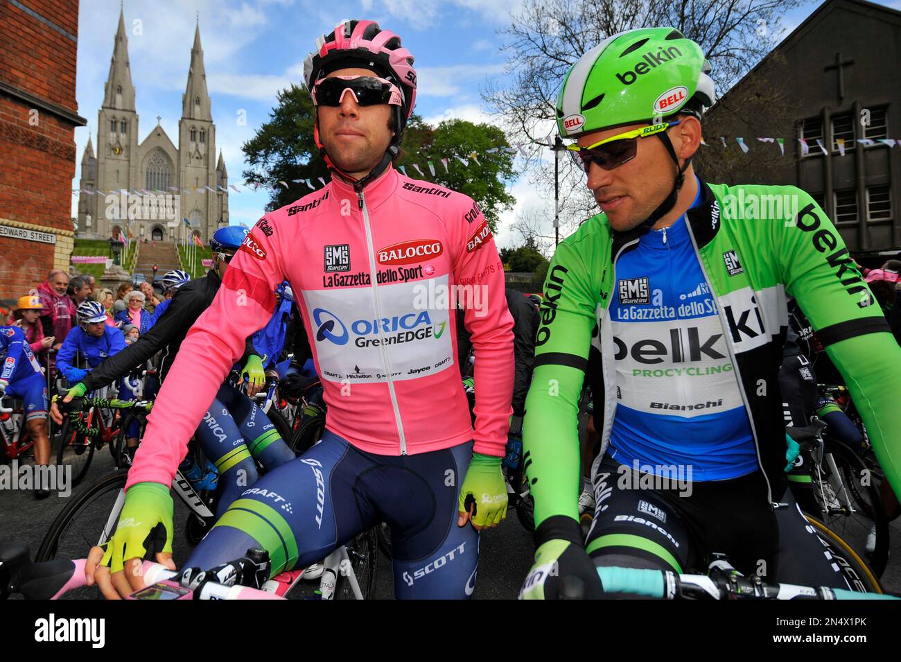 Overall leader Michael Matthews, of Australia, left, and Maarten Tjallingii, of The Netherlands, Marteen, wait for the start of the third stage of the Giro d'Italia, Tour of Italy cycling race, from Armagh, Northern Ireland, across the border to Dublin, Ireland, Sunday May 11, 2014. (AP Photo/Marco Alpozzi) Stockfoto