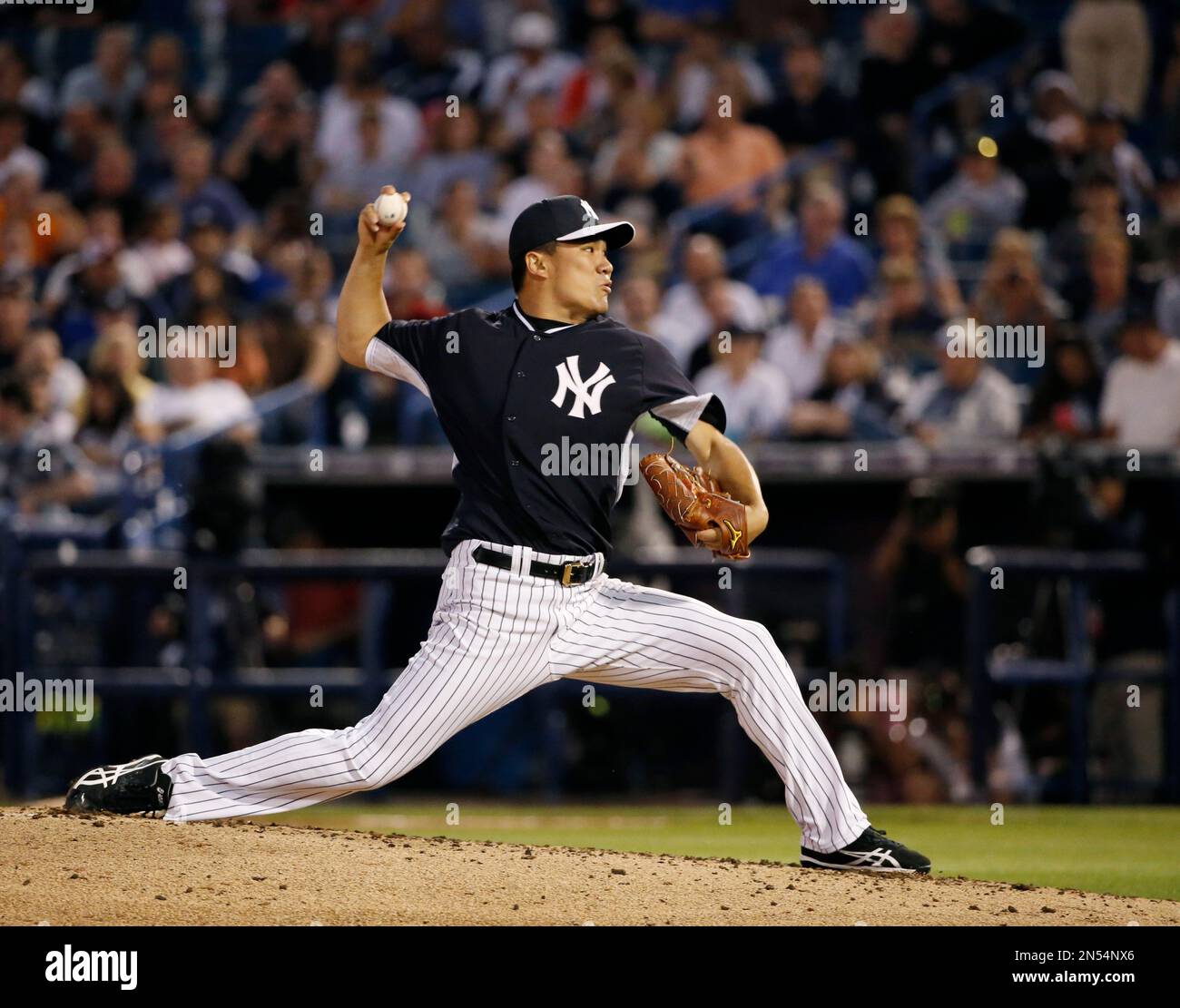 New York Yankees pitcher Masahiro Tanaka delivers in a spring exhibition baseball game against the Miami Marlins in Tampa, Fla., Friday, March 28, 2014. The Yankees defeated the Marlins 3-0.(AP Photo/Kathy Willens) Stockfoto