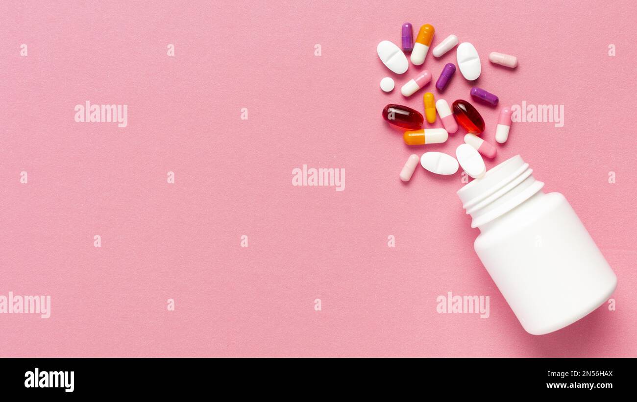Der pinkfarbene Hintergrund der Pillen-Flasche. Auflösung und hochwertige Fotos Stockfoto