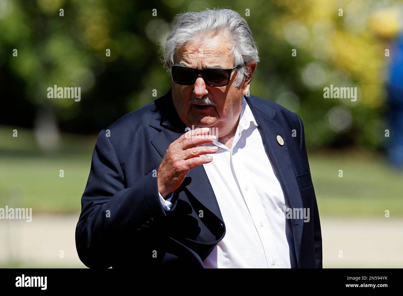 Uruguay's President Jose Mujica arrives at the Cerro Castillo presidential residence to lunch with newly sworn-in President Michelle Bachelet and visiting Latin American leaders, in Vina del Mar, Chile on Tuesday, March 11, 2014. Bachelet, who led Chile from 2006-2010, was sworn-in as president on Tuesday. (AP Photo/Luis Hidalgo) Stockfoto