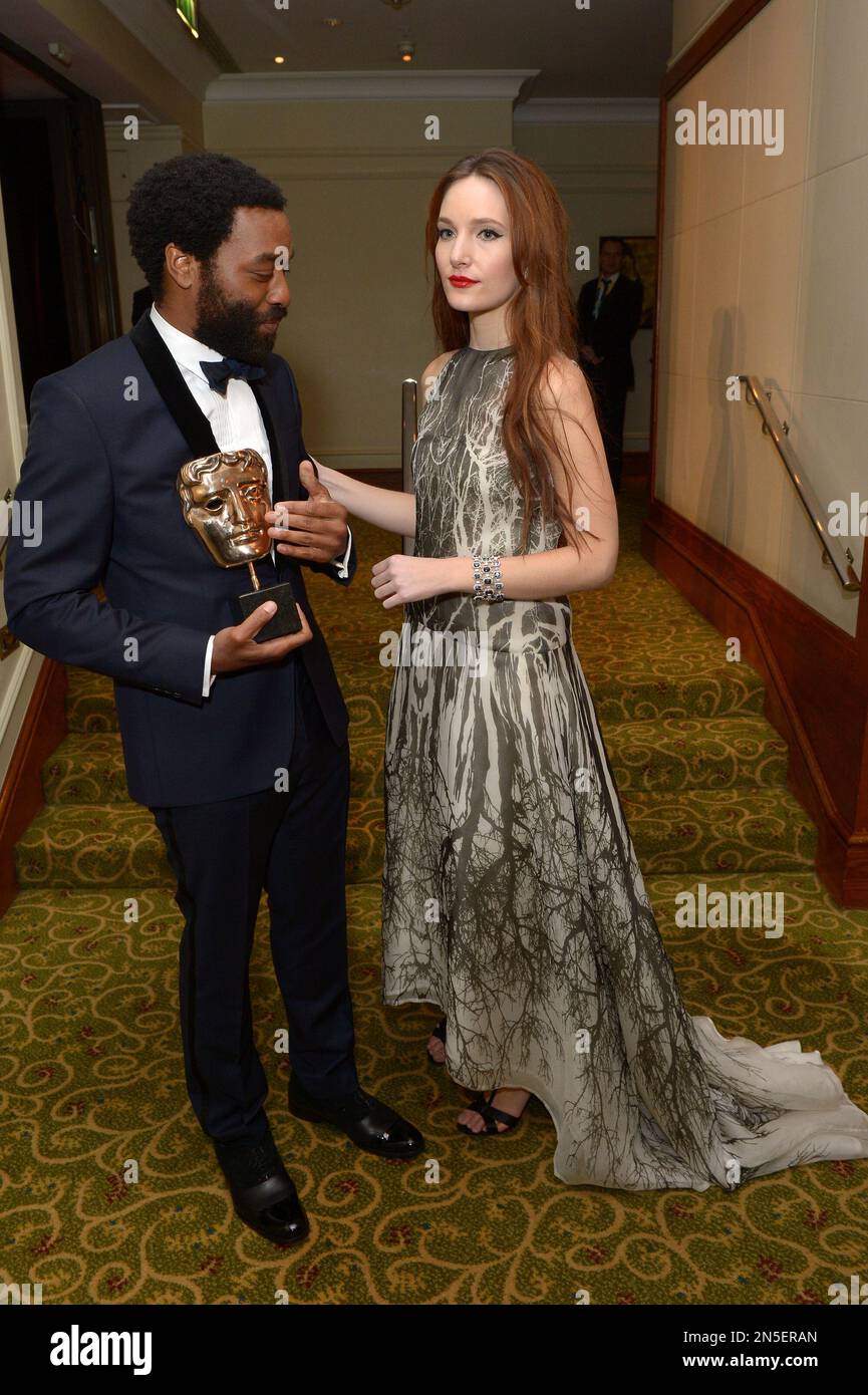 Chiwetel Ejiofor, winner of best actor for his role in 12 Years A Slave, and Sari Mercer attend the EE British Academy Film Awards Official After Party at the Grosvenor House Hotel on Sunday Feb. 16, 2014, in London. (photos by Jon Furniss/Invision/AP) Stockfoto