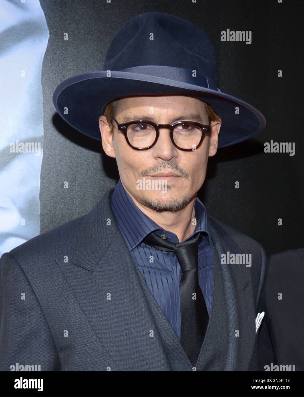 Johnny Depp arrives at the US premiere of "3 Days to Kill" at ArcLight Cinemas Hollywood on Wednesday, Feb. 12, 2014, in Los Angeles. (Photo by John Shearer/Invision/AP) Stockfoto