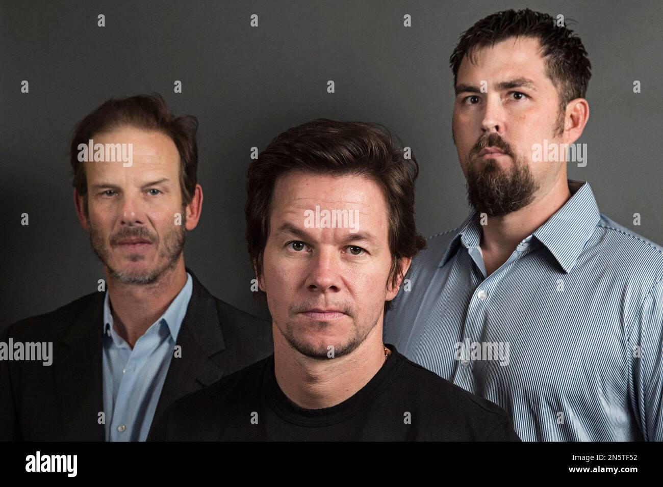 This Dec. 5, 2013 photo shows director Peter Berg, from left, actor