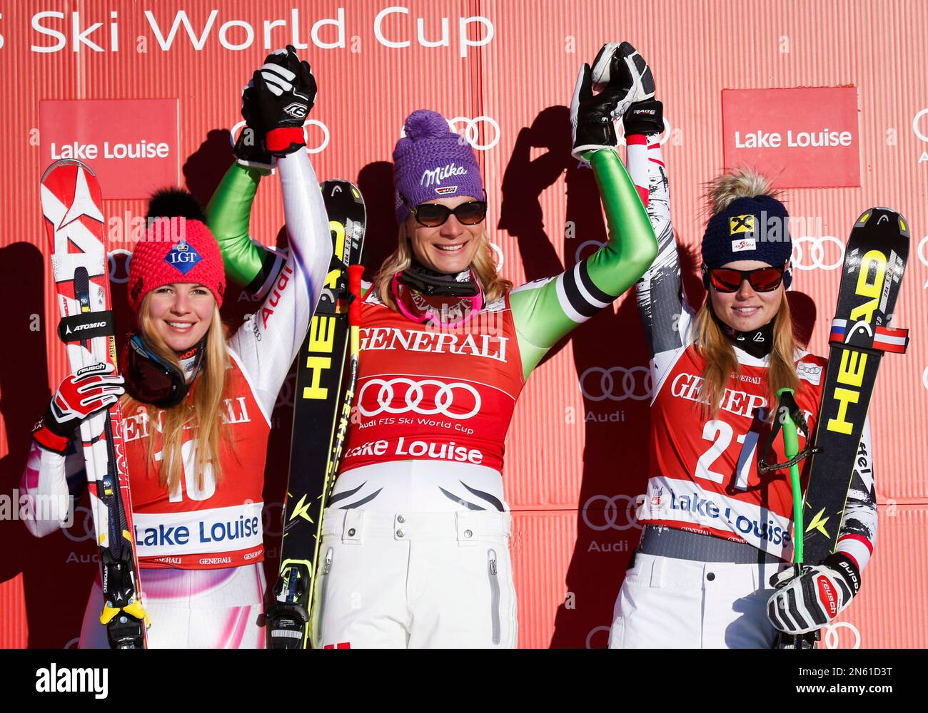 Germany's Maria Hoefl-Riesch, center, celebrates her victory with