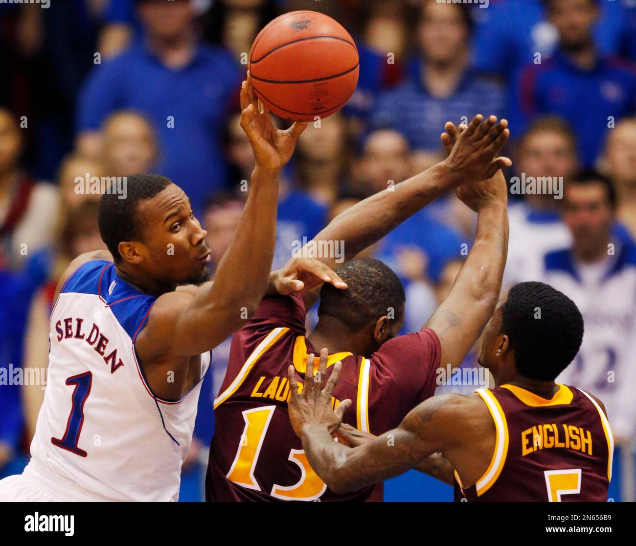 Kansas guard Wayne Selden, Jr. (1) passes to a teammate behind Iona