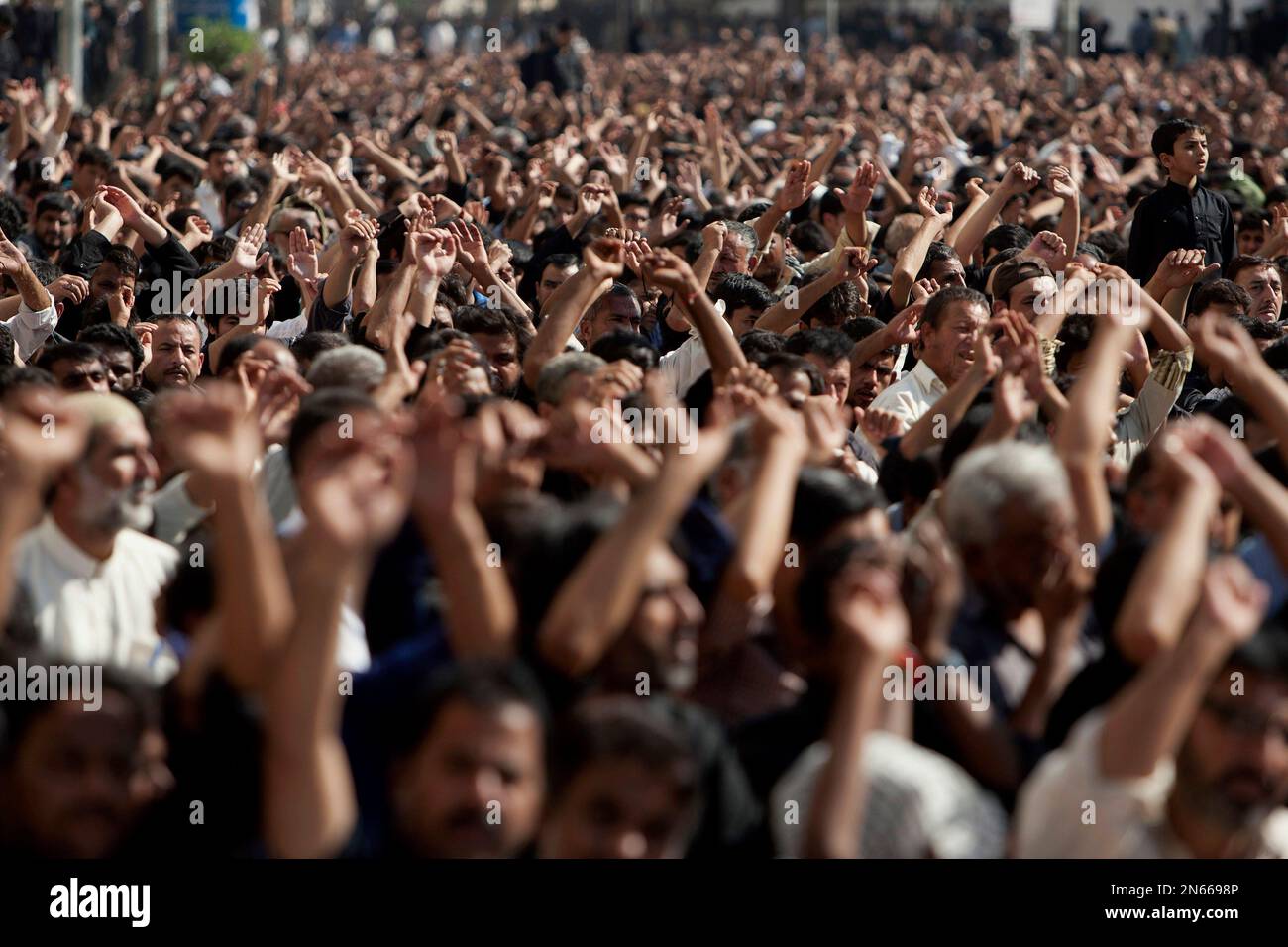 Pakistani Shiite Muslims chant religious slogans during an Ashoura ...