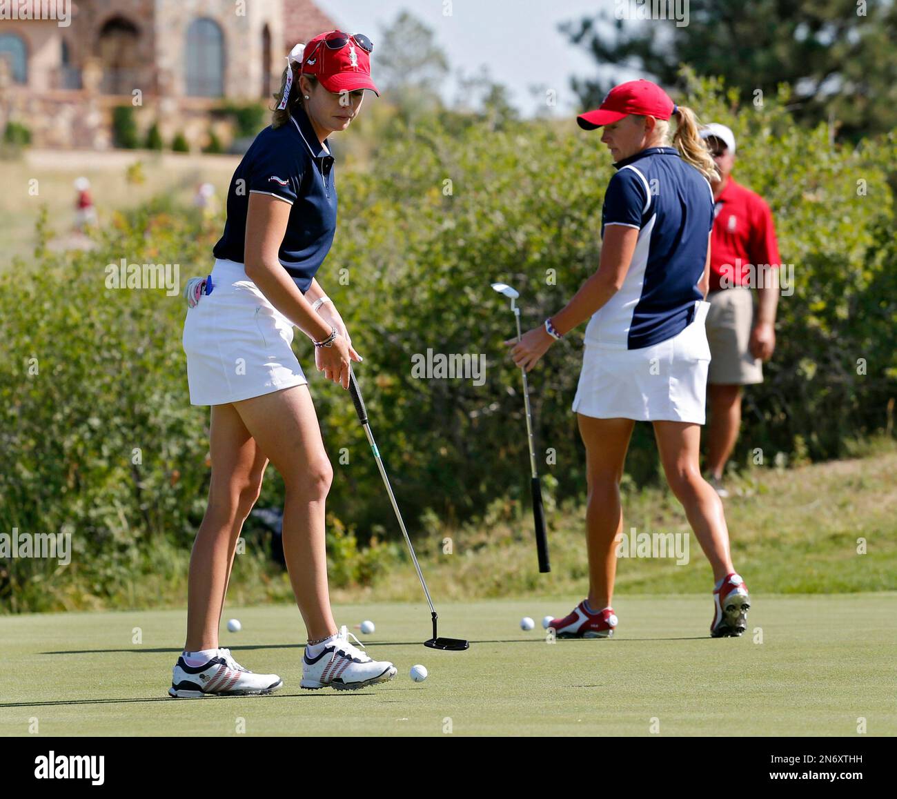 United States' Paula Creamer, left, and teammate Stacy Lewis practice