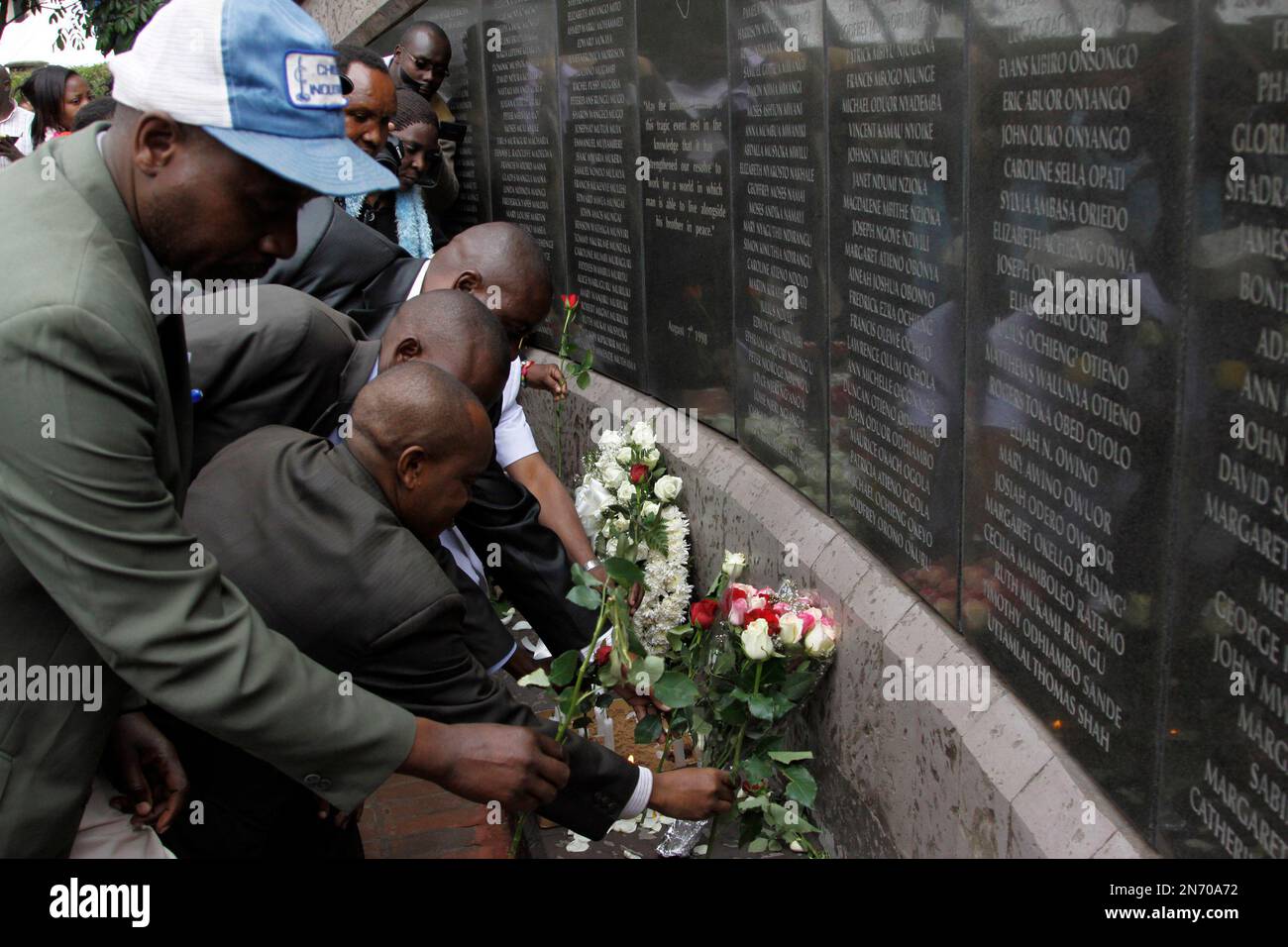 An unidentified man lays flowers at the US Embassy bombing memorial