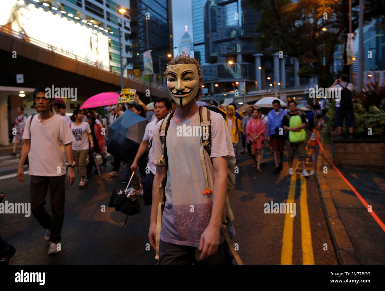 A protester wears a mask during an annual pro-democracy protest on a